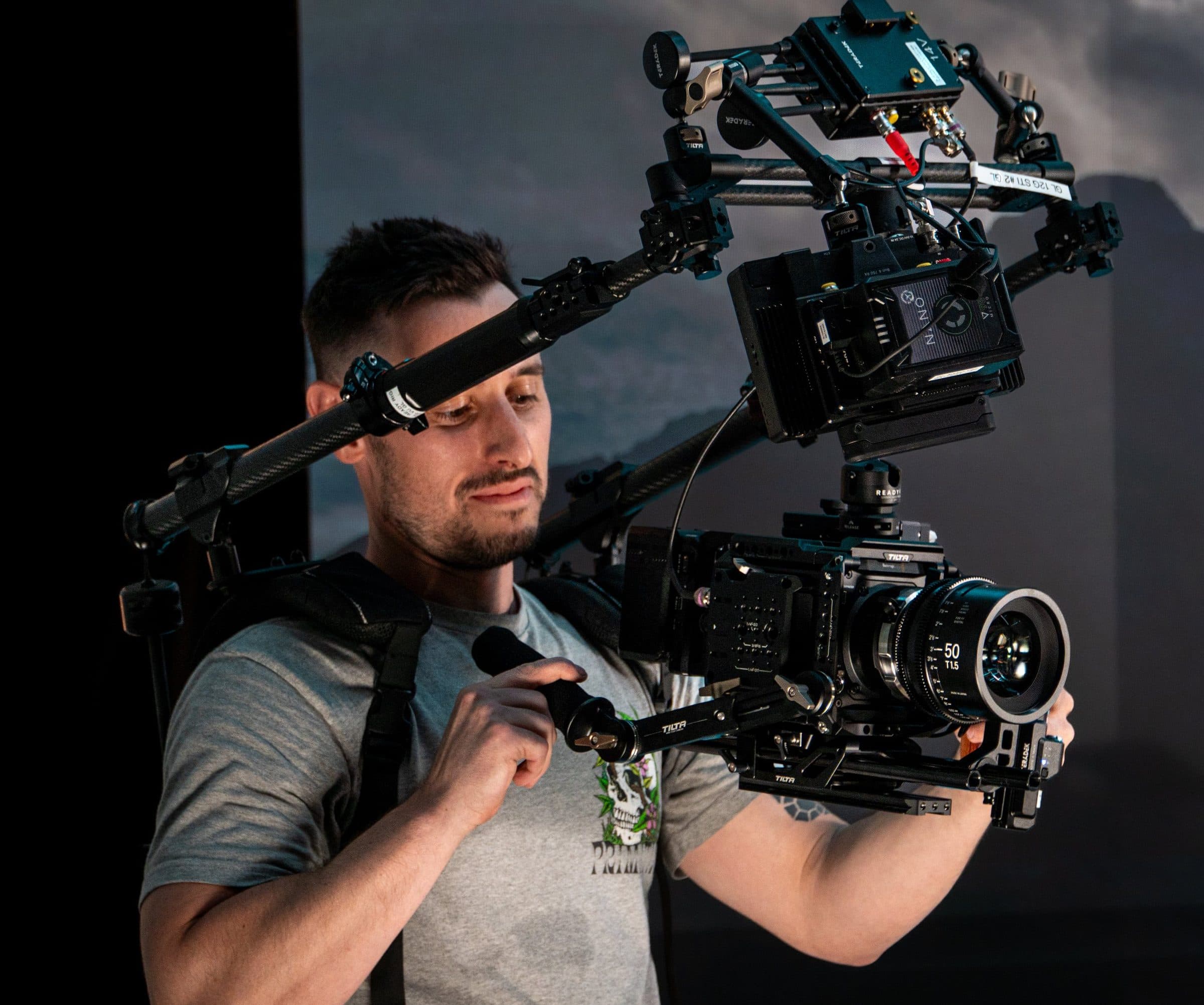 Garrett Krumpe behind a camera rig on set