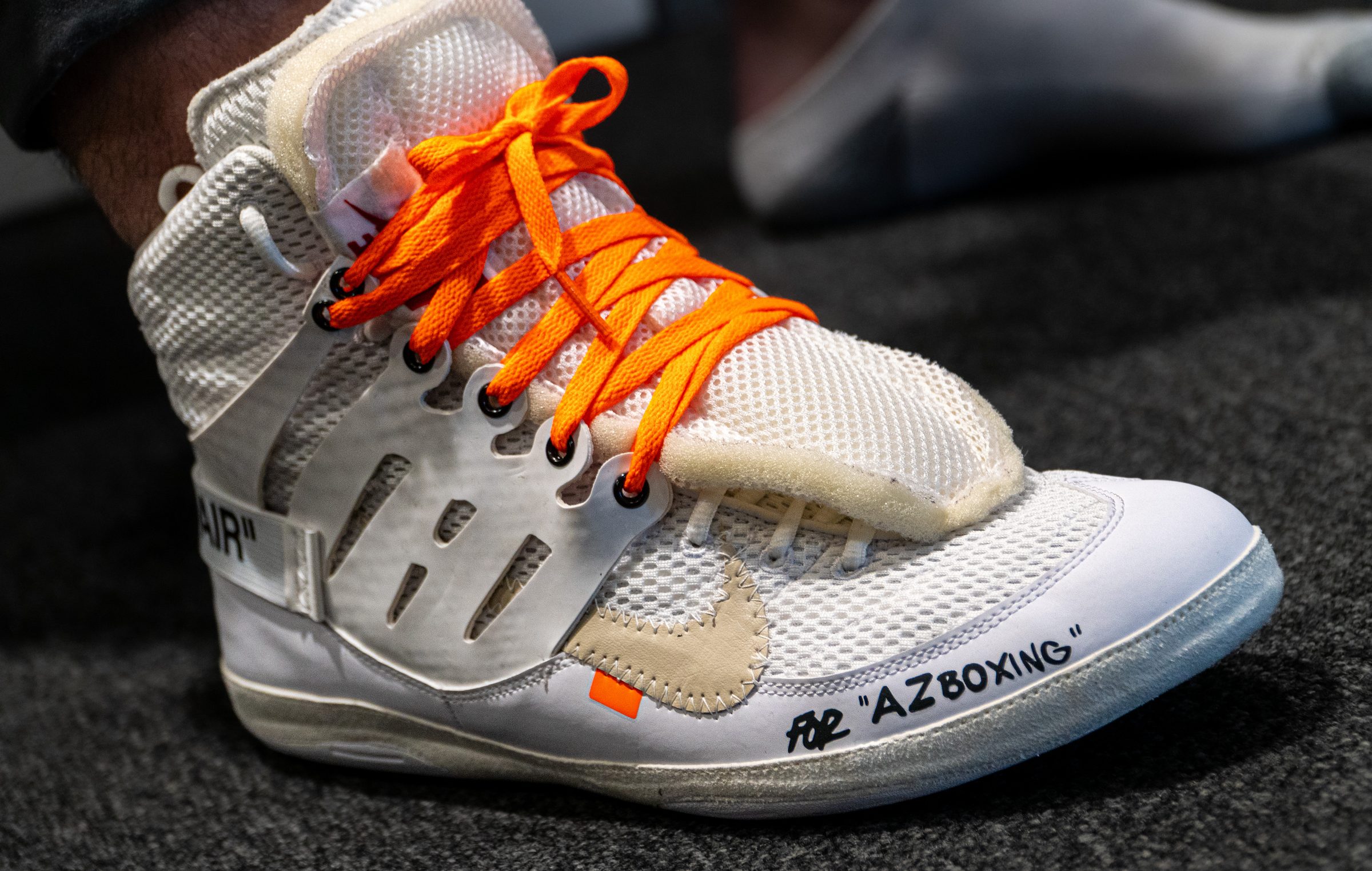 White AZ Boxing shoe with orange laces