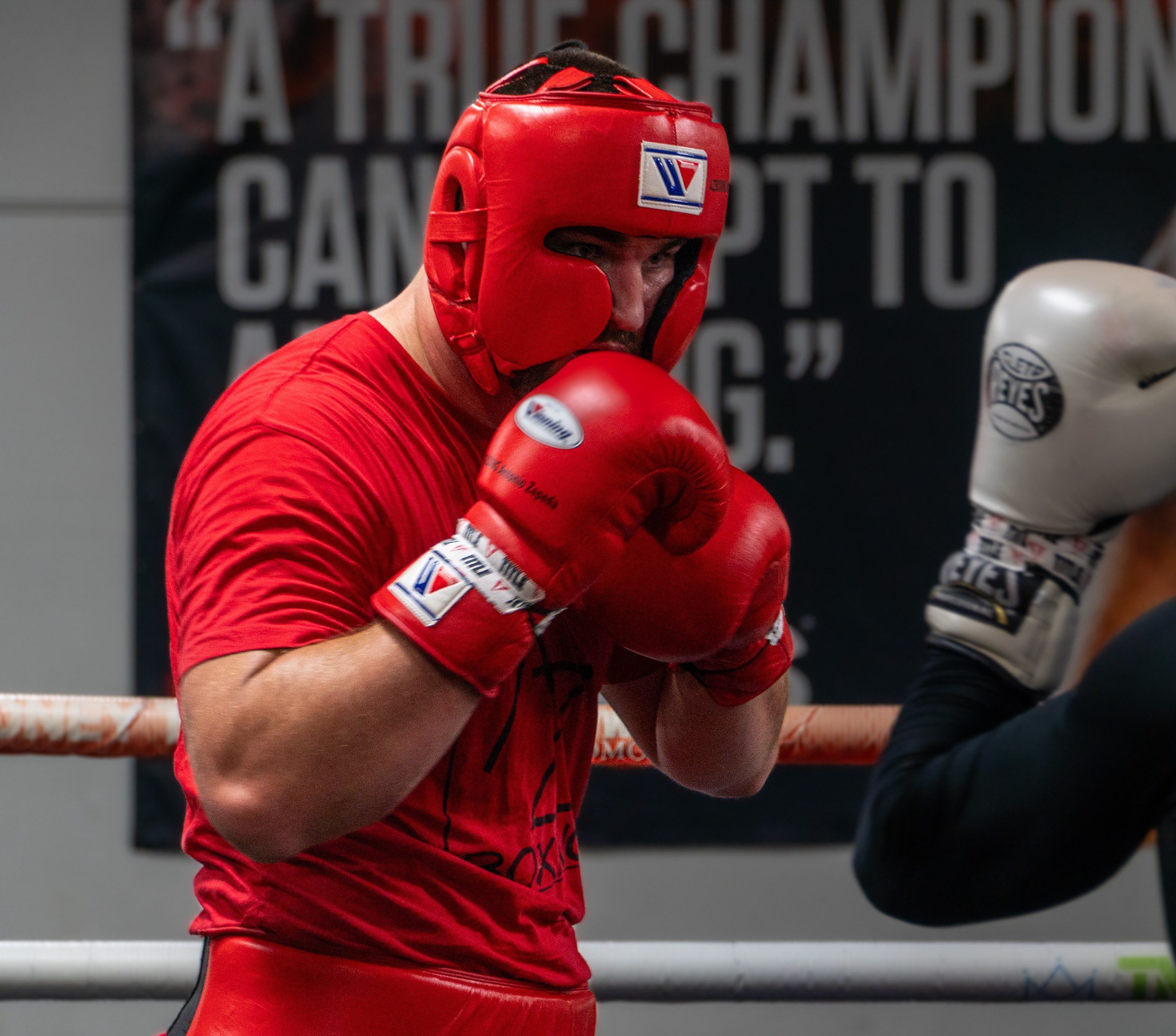 Antonio Zepeda in red headgear with his gloves up