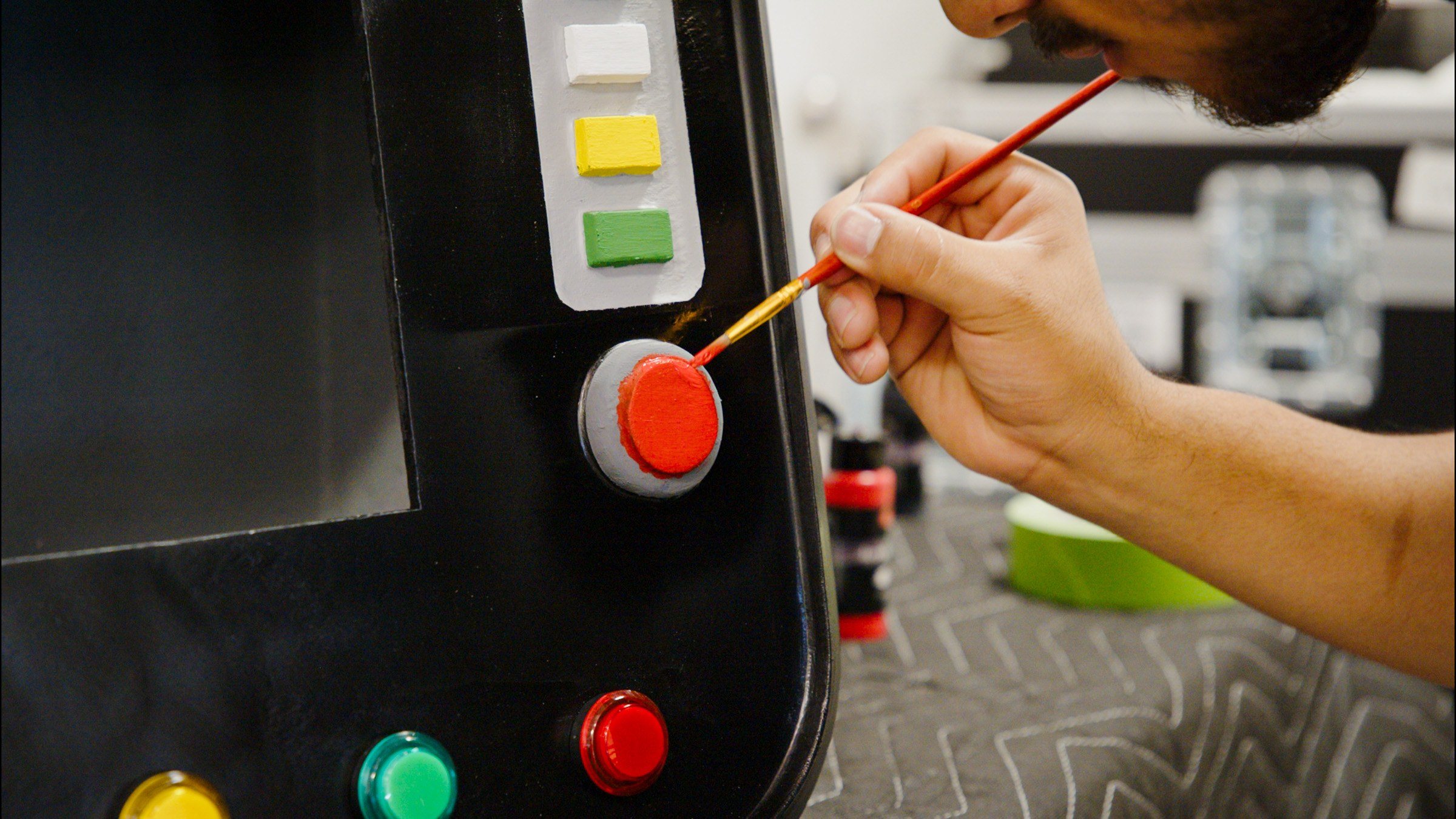 Painting the trim on an arcade control panel