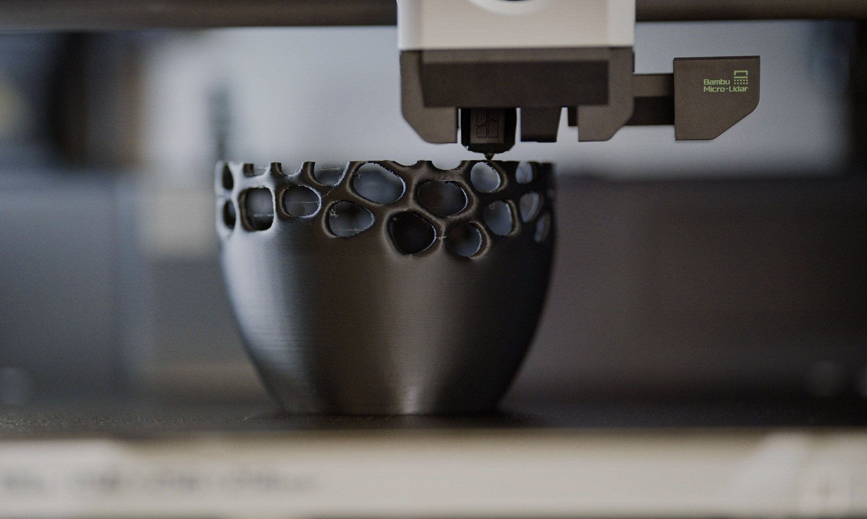 3D printer finishing a honeycomb vessel