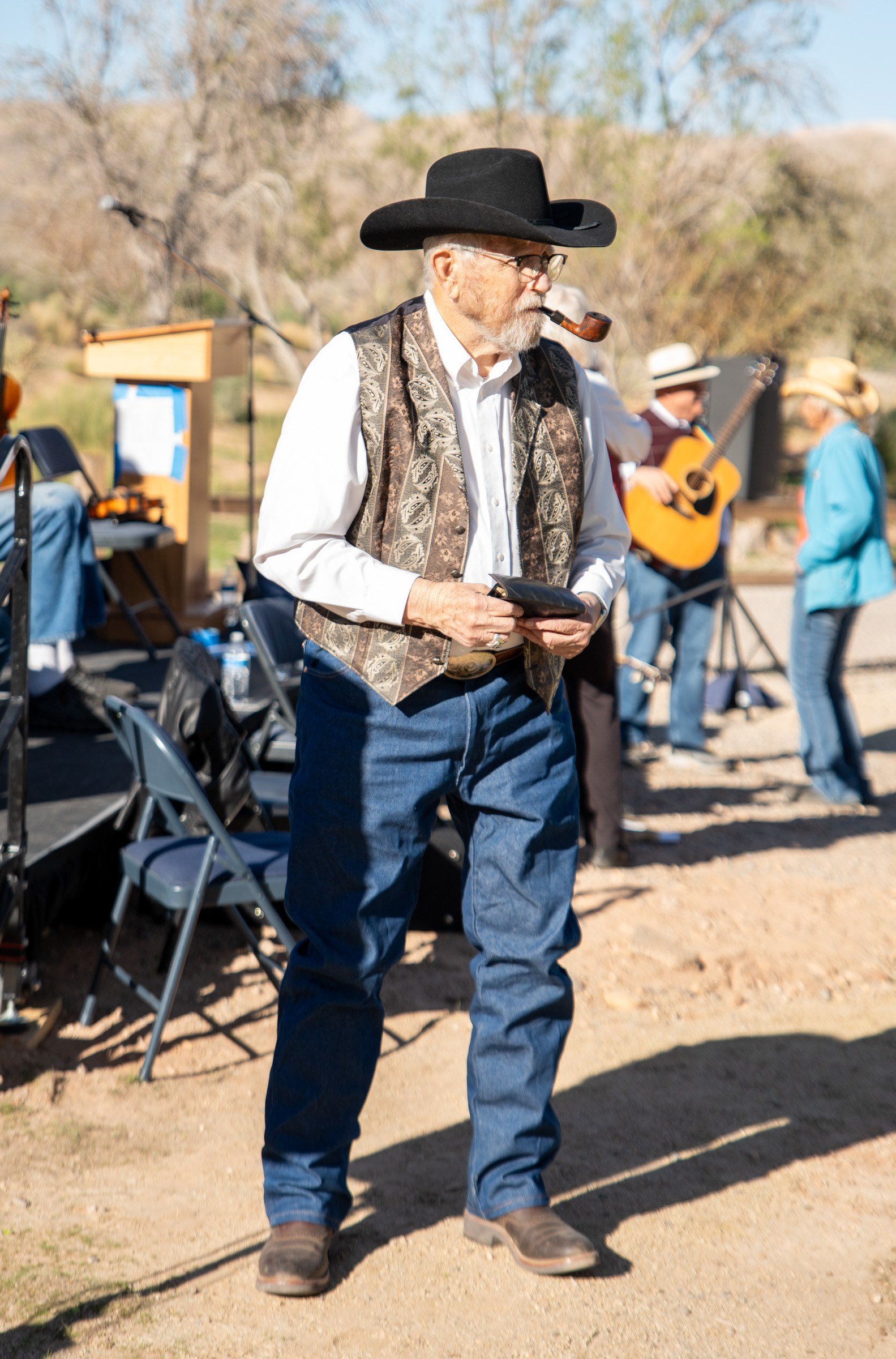 Guest in a cowboy hat and vest at the anniversary event
