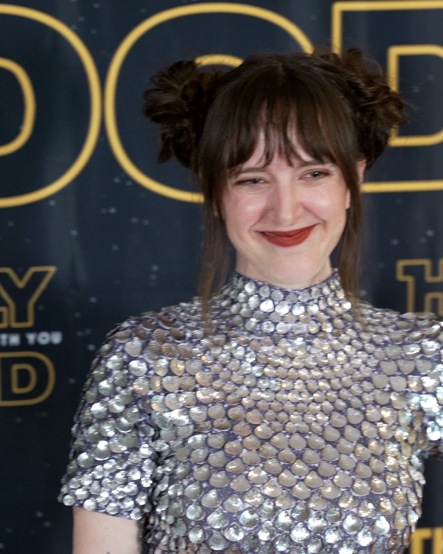 Cast member in a sequin top on the step and repeat