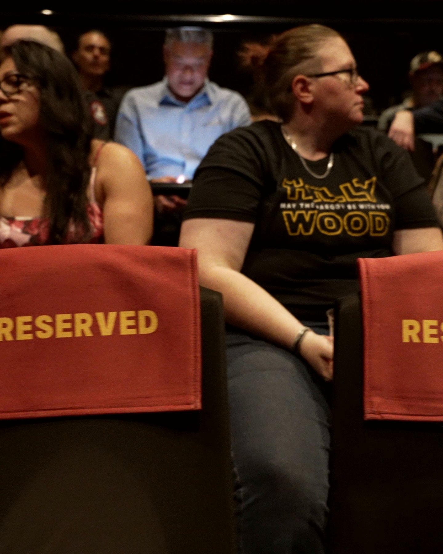 Guests filling the reserved rows before the screening