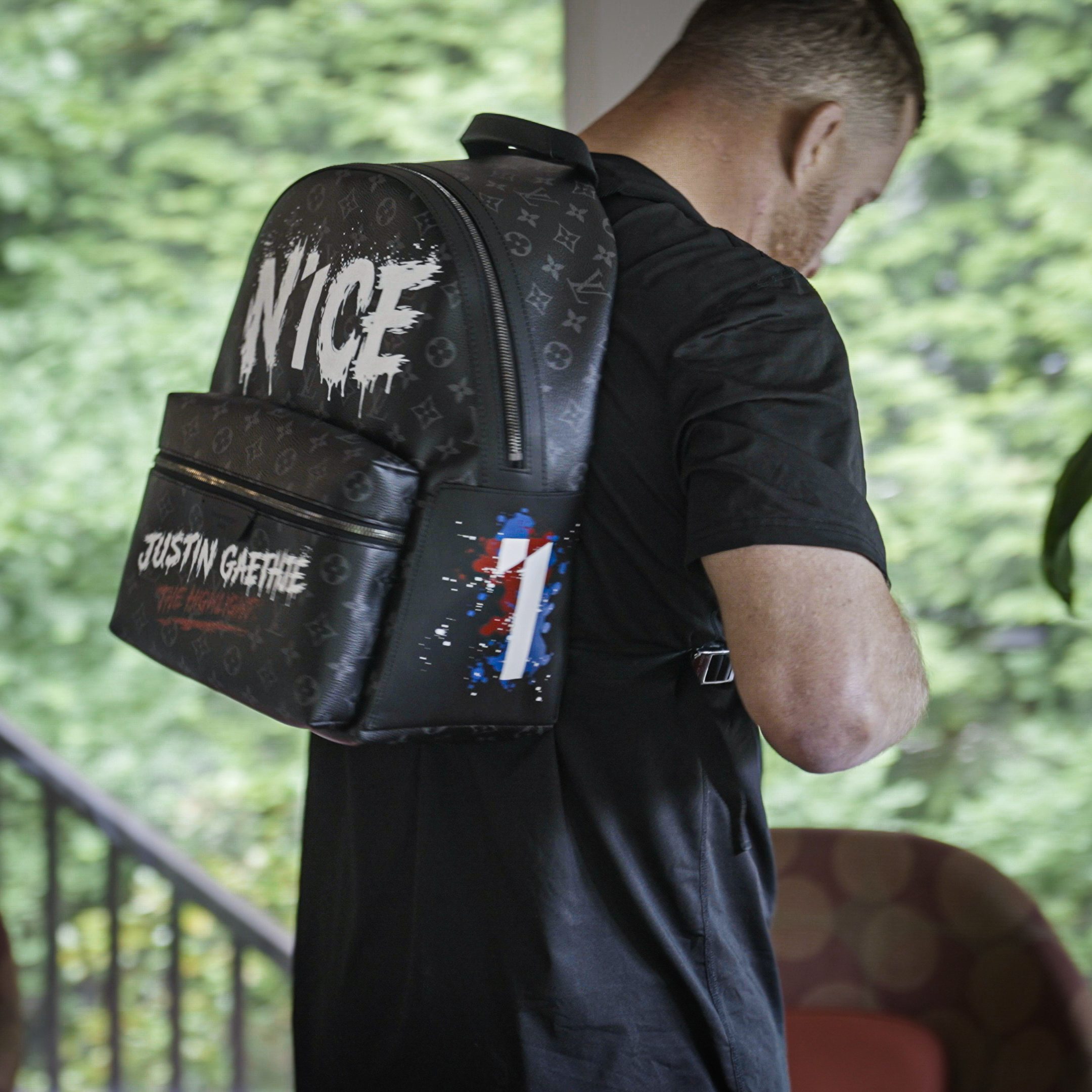 Gaethje wearing the custom N1CE backpack outdoors