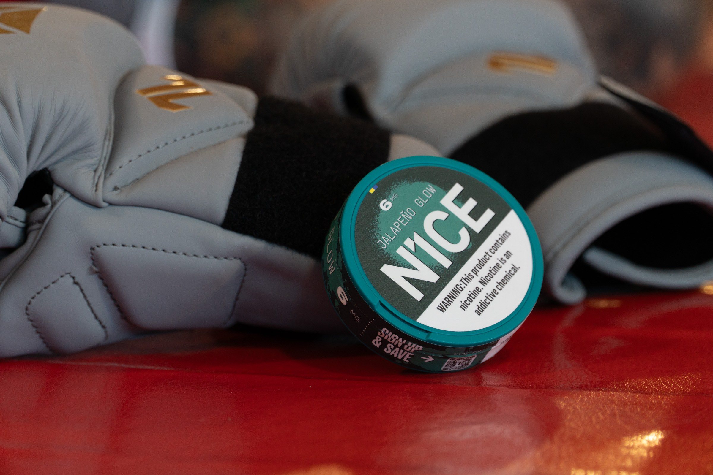 N1CE tin resting on Cody Garbrandt's gloves